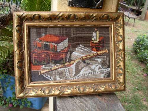 NICE FRAME CONTAINING A STILL LIFE TAPESTRY OF  BOOKS, CANDLE, FLUTE ETC