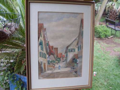 VINTAGE FRAMED ORIGINAL SMALL WATERCOLOUR OF A TOWN WITH STREET & WOMAN STROLLING.