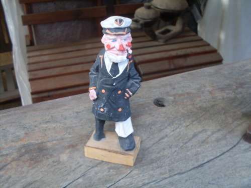 CARVED PAINTED WOODEN ORNAMENT OF A SEA CAPTAIN WITH PEG LEG