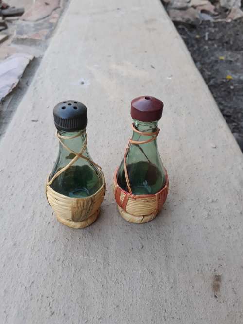 YOU CAN ONLY BUT DELIGHT IN THESE VINTAGE VINO BOTTLES STRAW BASE SALT & PEPPER POTS. LOVE THEM!
