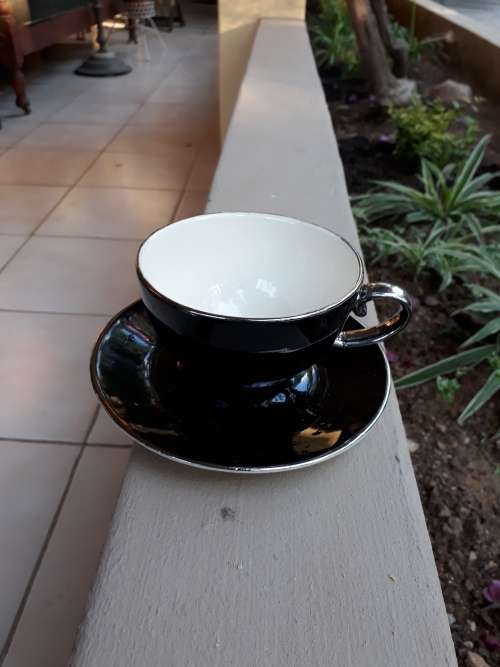 RENOWNED CERAMICS ARTIST PETER MTHOMBENI SIGNED TEA CUP & SAUCER BLACK WITH CHROME RIMS. WOW!