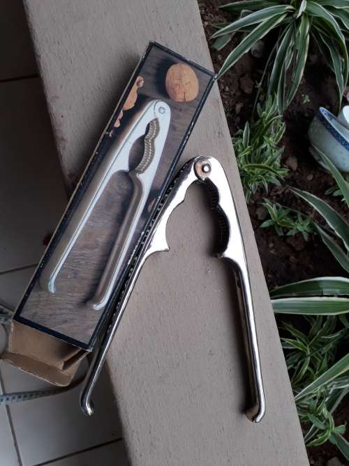 IN A NUTSHELL!! HEREWITH A BOXED VINTAGE SILVER PLATED NUT CRACKER