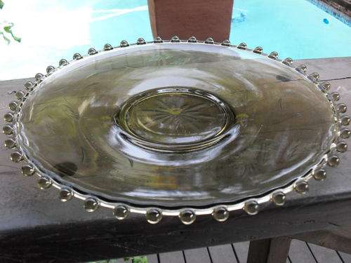 BEAUTIFUL SMOKIE GLASS WHEAT CUT WITH GLASS BALL TYPES AROUND THE RIMS. A MUST VIEW