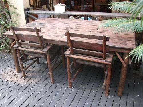 NAB YOURSELF A BARGAIN!!!! LARGE WOOD TABLE & 6 COMFORTABLE CHAIRS. RUSTIC. DO LOOK!