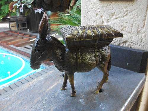 AWESOME WOULD SAY VINTAGE DONKEY CIGARETTE DISPENSER. GIVES THE ASS SOMETHING ELSE TO DO!