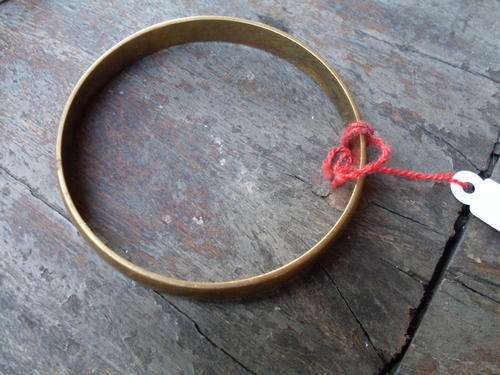 IN A NUTSHELL THIS IS A SMALL BRASS BANGLE