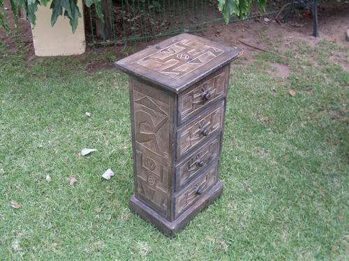 LOOKS LIKE A UNIQUE AFRICAN HAND CARVED SMALL SOLID WOOD 4 DRAWER PIECE. IT'S GORGEOUS