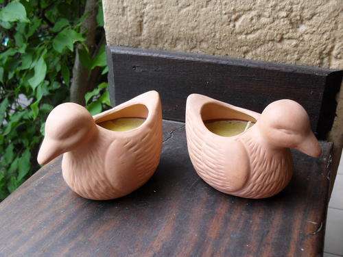 TWO DELIGHTFUL AND SWEET TERRACOTA DUCKS WITH CANDLES