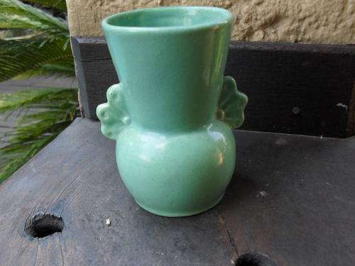 Small PALE GREEN LUCIA WARE VASE WITH WING TYPE HANDLES. NICE PIECE