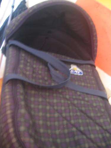 Blue and green U and Me carry cot