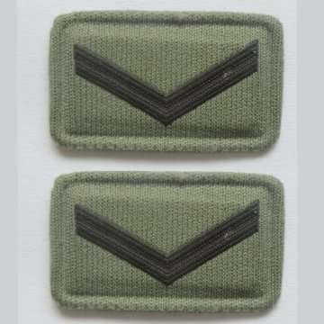 S.A.D.F LANCE CORPORAL EMBOSSED RANK/BADGE INSIGNIA WITH PINS.