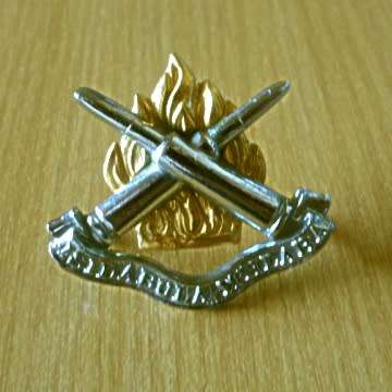 Ammunition Corps Cap Badge With Screws In Place.