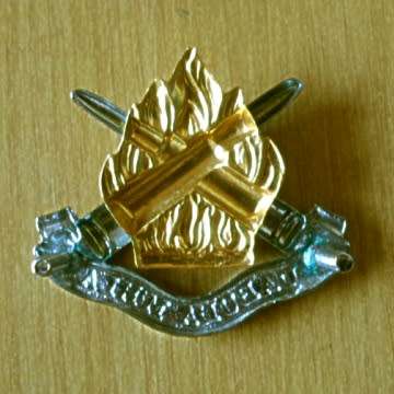 Ammunition Corps Cap Badge With Screws In Place.