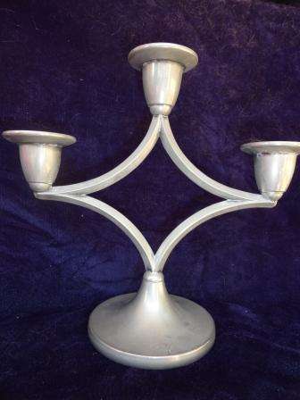 A delightful three piece candlestand