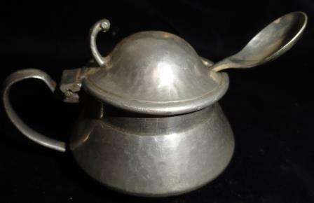 A vintage pewter mustard pot with stainless nickel spoon.