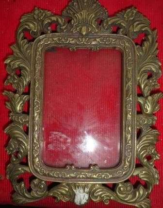 A solid brass vintage ornate picture frame