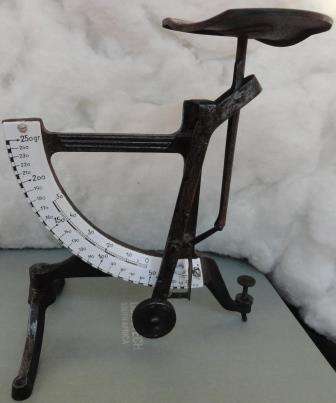 A rare and scarce Concave postal scale with enamel dial