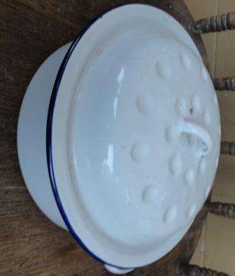 A smaill white ENAMEL casserole dish