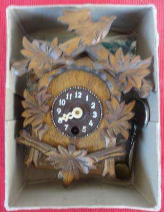 A boxed rare German mini cuckoo clock with key, pendulum etc ....(Not tested_.