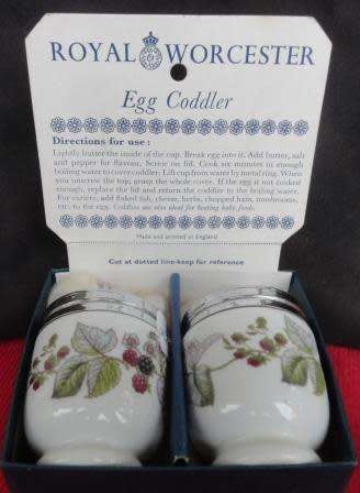 A boxed pair of Royal Worcester egg coddlers