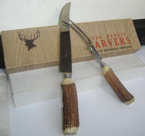 A pair of mint stag handle carvers