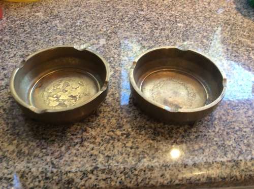 Pair of brass ashtrays.