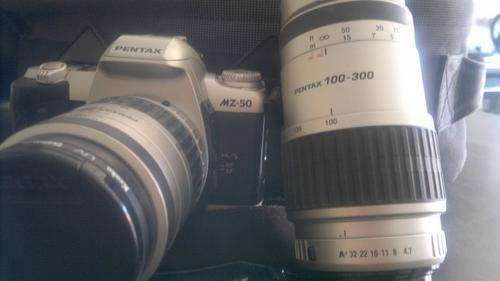 Pentax MZ50 with additional 100-300 lens, battery pack and camera bag - all offers considered