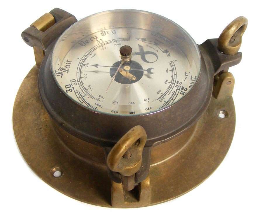 Vintage barometer in solid brass porthole style casing