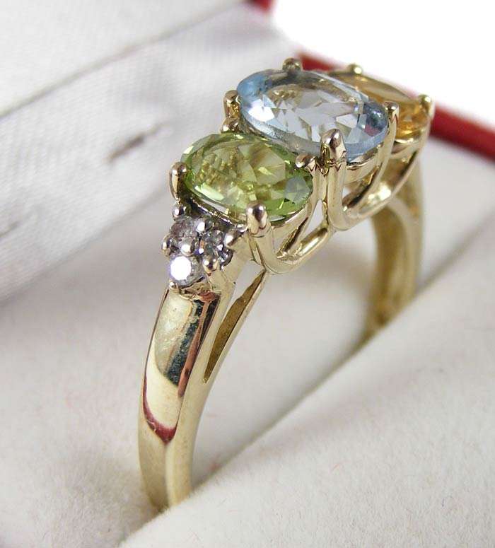 Beautiful 9ct Yellow gold, citrine, diamond, topaz and peridot dress dring