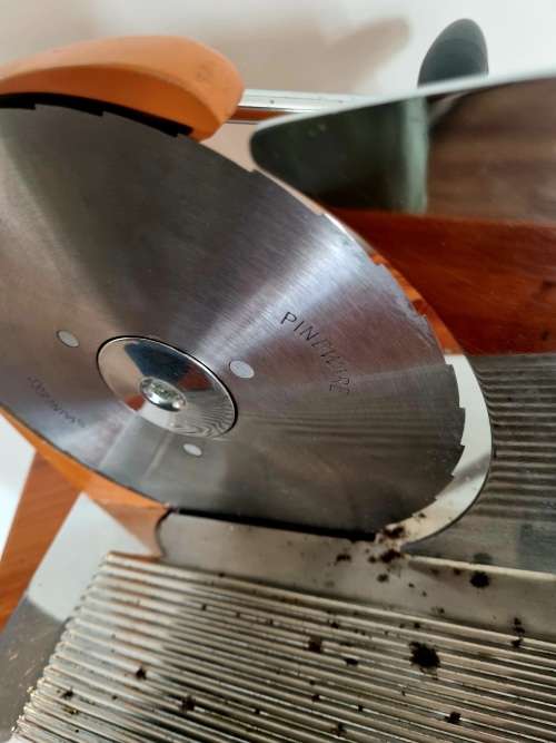 Orange enamel and steel retro bread slicer