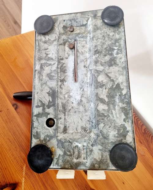 Orange enamel and steel retro bread slicer