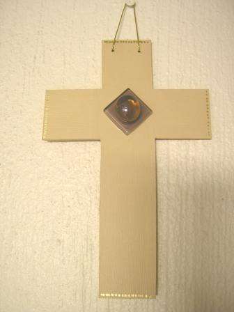 Hanging beige wooden cross