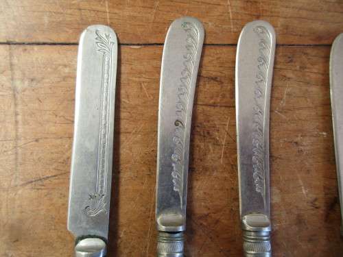 6 Red resin handled butter knives