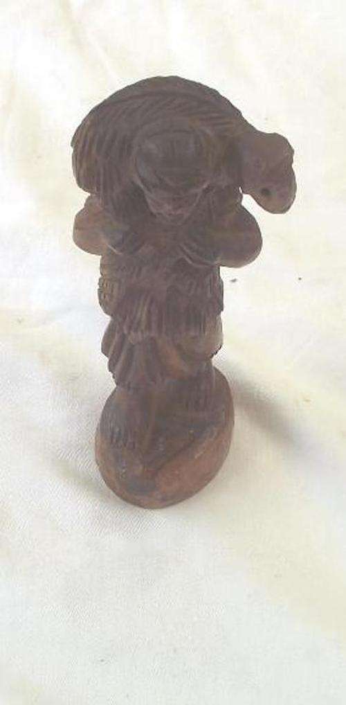 WOODEN FIGURINE OF A SHEPHERD CARRYING A LAMB