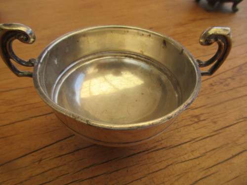 A TWIN HANDLED BOWL ( WALKER AND HALL) AND A CREAMER JUG SILVER PLATED