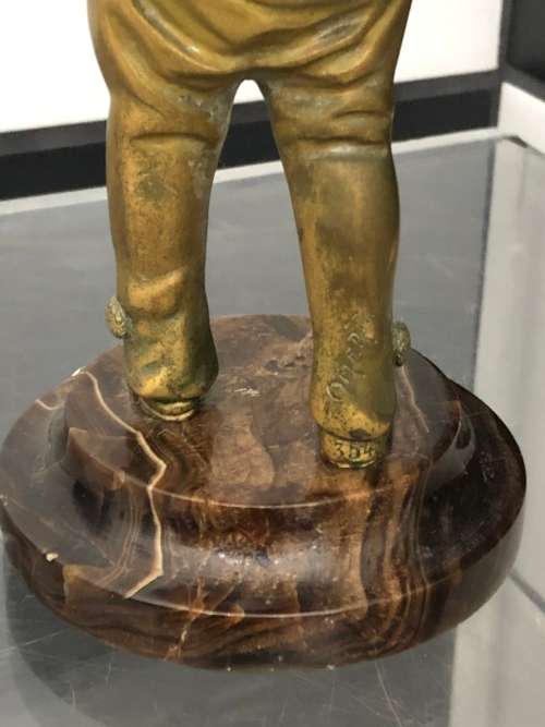FRENCH BRONZE AND IVORY FIGURE ON MARBLE BASE OF A BOY BY GEORGES OMERTH 1895-1914