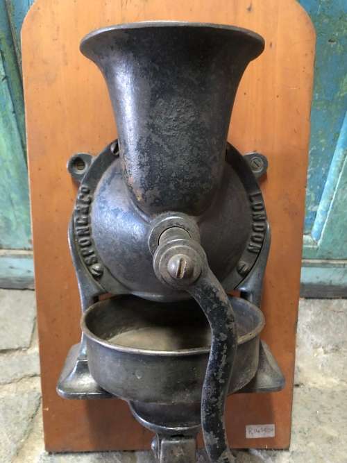 ORIGINAL SPONG COFFEE GRINDER WITH ORIGINAL BOWL MOUNTED ON YELLOW WOOD BACKING