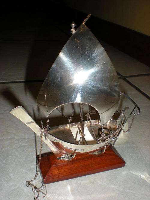 A VERY WELL MADE MODEL OF A SHIP ON STAND IN SOLID SILVER
