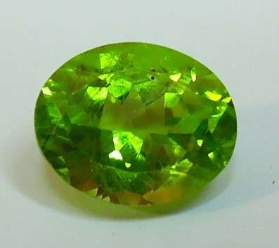 Certified Apple Green Peridot - SI, 3.12 ct. - Oval Faceted