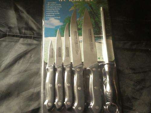 CHEFS KNIVES PLUS SHARPENER, STAINLESS STEEL, HIGH QUALITY IN MY OPINION. 5 ON AUCTION