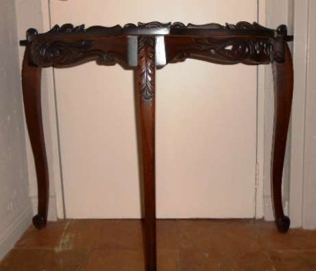 Ornately carved occasional half-moon table with Louis XV  legs and glass top