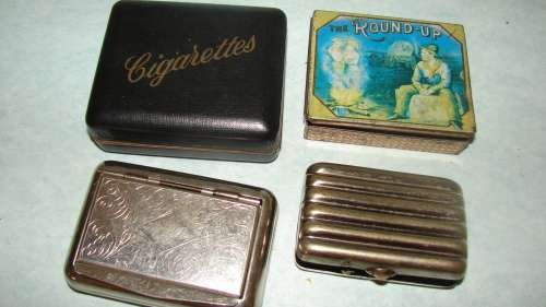 5 Vintage Cigarette Holders and  a Tabacco tin
