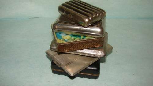 5 Vintage Cigarette Holders and  a Tabacco tin