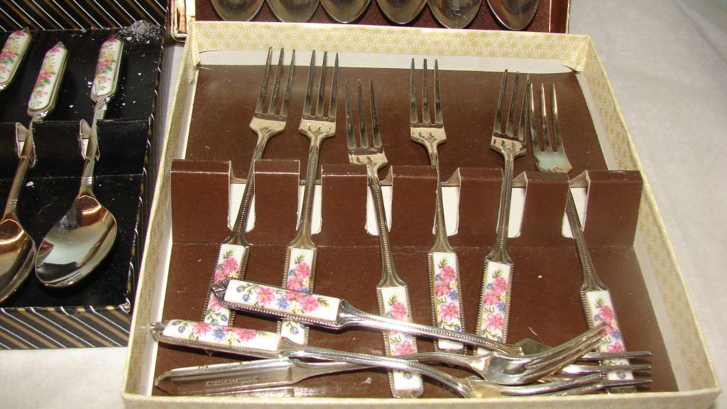 3 Box sets. Floral Ceramic Handled.  12 Tea Spoons and 9 Cake Forks