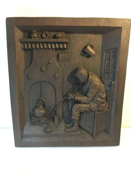 A HEAVY CARVED ANTIQUE BLACK FOREST FOLK WALL PLAQUE