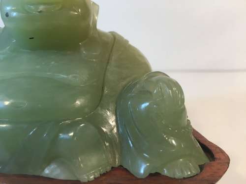 A CHINESE ORIENTAL GREEN STONE CARVED BUDDHA