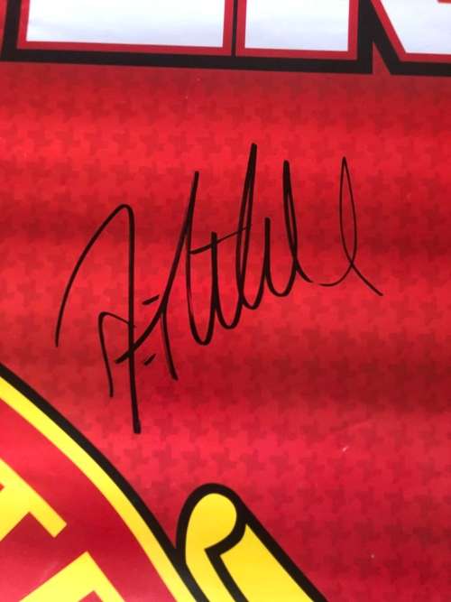 A MANCHESTER UNITED POSTER SIGNED BY THE TEAM