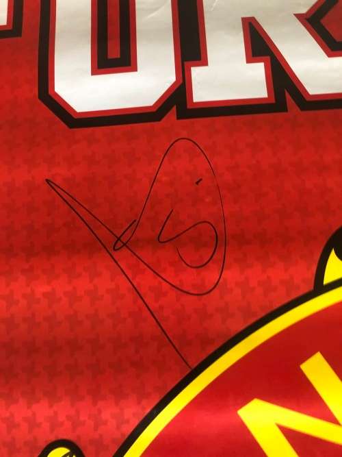 A MANCHESTER UNITED POSTER SIGNED BY THE TEAM
