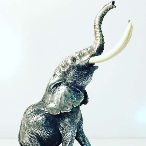 A PATRICK MAVROS SOLID HALLMARKED SILVER ELEPHANT ON WOODEN BASE
