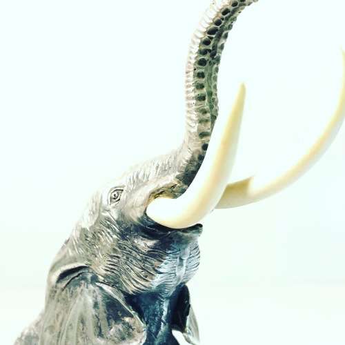 A PATRICK MAVROS SOLID HALLMARKED SILVER ELEPHANT ON WOODEN BASE